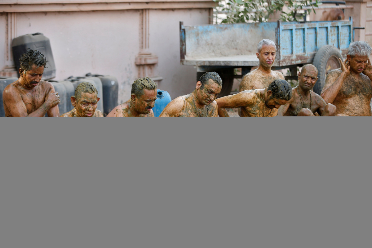 People apply cow dung on their bodies during 