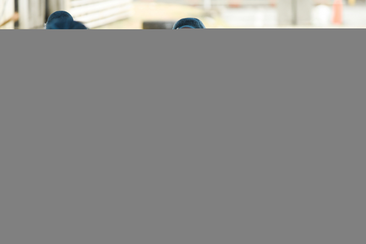 Health workers wait for the arrival of residents to be vaccinated against the coronavirus disease (COVID-19) at a drive-thru vaccination site for bedridden and persons with disabilities, in Makati city, Metro Manila, Philippines, May 7, 2021. REUTERS/Lisa