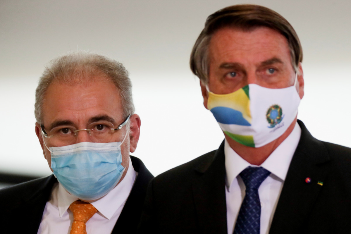 BRAZIL's Health Minister Marcelo Queiroga and BRAZIL's President Jair Bolsonaro arrive for a ceremony of release of resources for Primary Health Care in combat of the coronavirus disease (COVID-19), at the Planalto Palace in Brasilia, BRAZIL May 11, 2021.