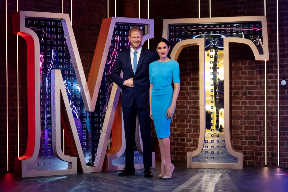 Figures of Madame Tussauds London's Britain's Prince Harry and Meghan, Duchess of Sussex, stand in their new position in London, Britain May 12, 2021. Picture taken May 12, 2021. Madame Tussauds London/Handout via REUTERS