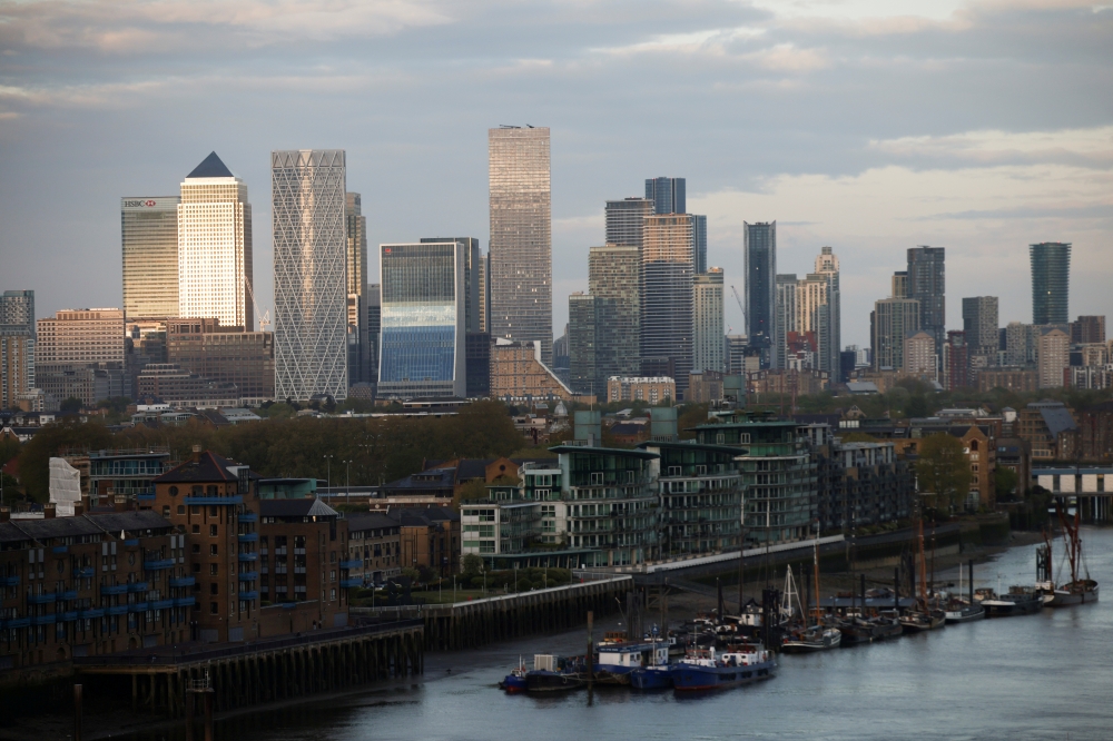FILE PHOTO: Skyscrapers in The City of London financial district are seen from City Hall in London, Britain, May 8, 2021. REUTERS/Henry Nicholls