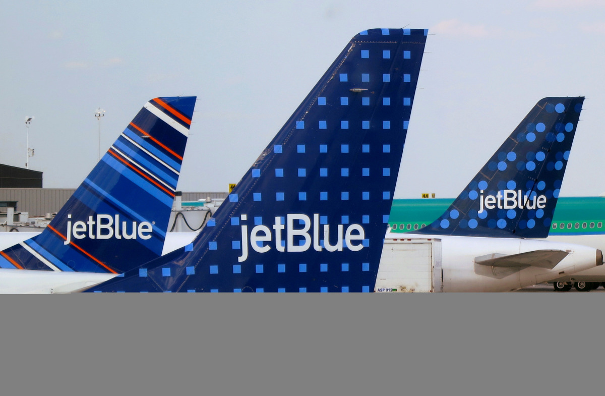 FILE PHOTO: JetBlue Airways aircraft are pictured at departure gates at John F. Kennedy International Airport in New York June 15, 2013. REUTERS/Fred Prouser/File Photo
