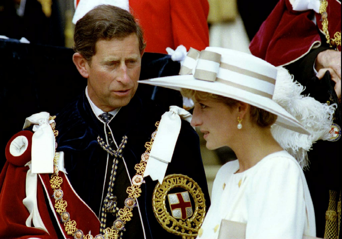 FILE PHOTO: Prince Charles looks towards Princess Diana as they await their carriage to depart the Order of the Garter ceremony at Windsor Castle June 15, 1992. REUTERS/Kevin Lamarque/File Photo
