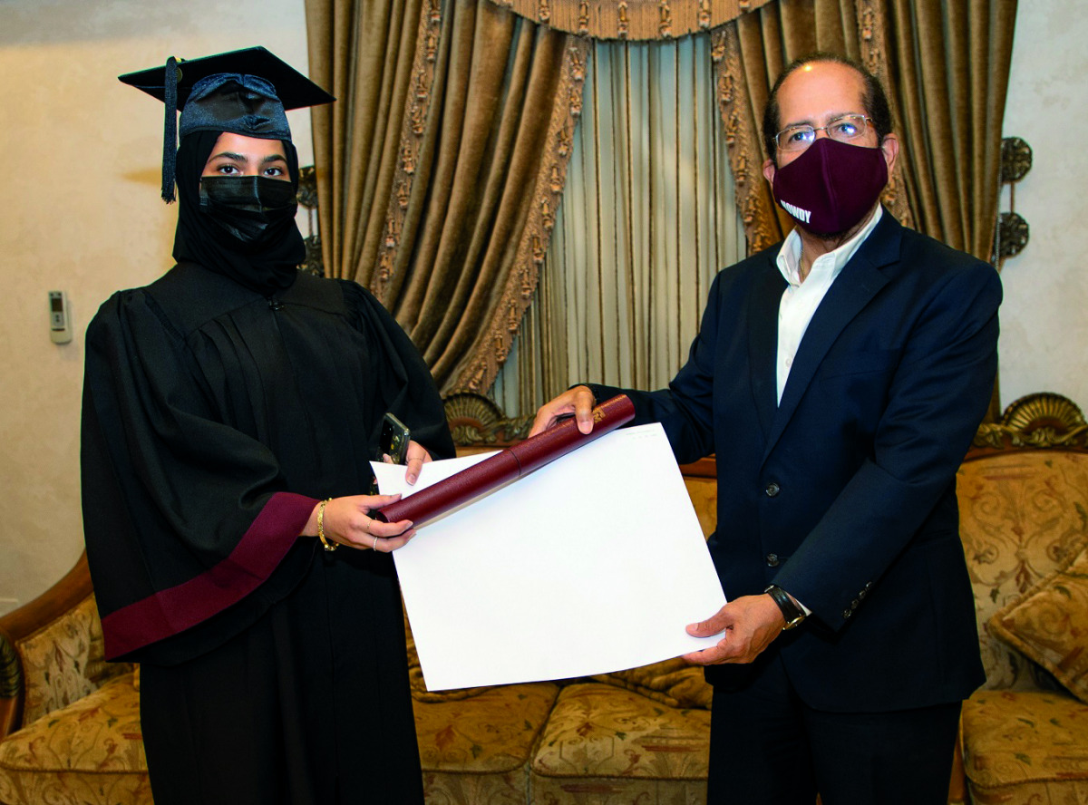 Texas A&M University Dean César Octavio Malavé presents degree to a graduating engineer.
