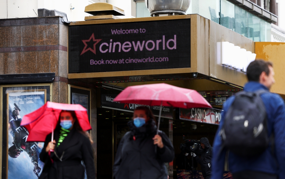 File photo: People walk past a Cineworld in Leicester's Square, amid the coronavirus disease (COVID-19) outbreak in London, Britain, October 4, 2020. Reuters/Henry Nicholls/File Photo