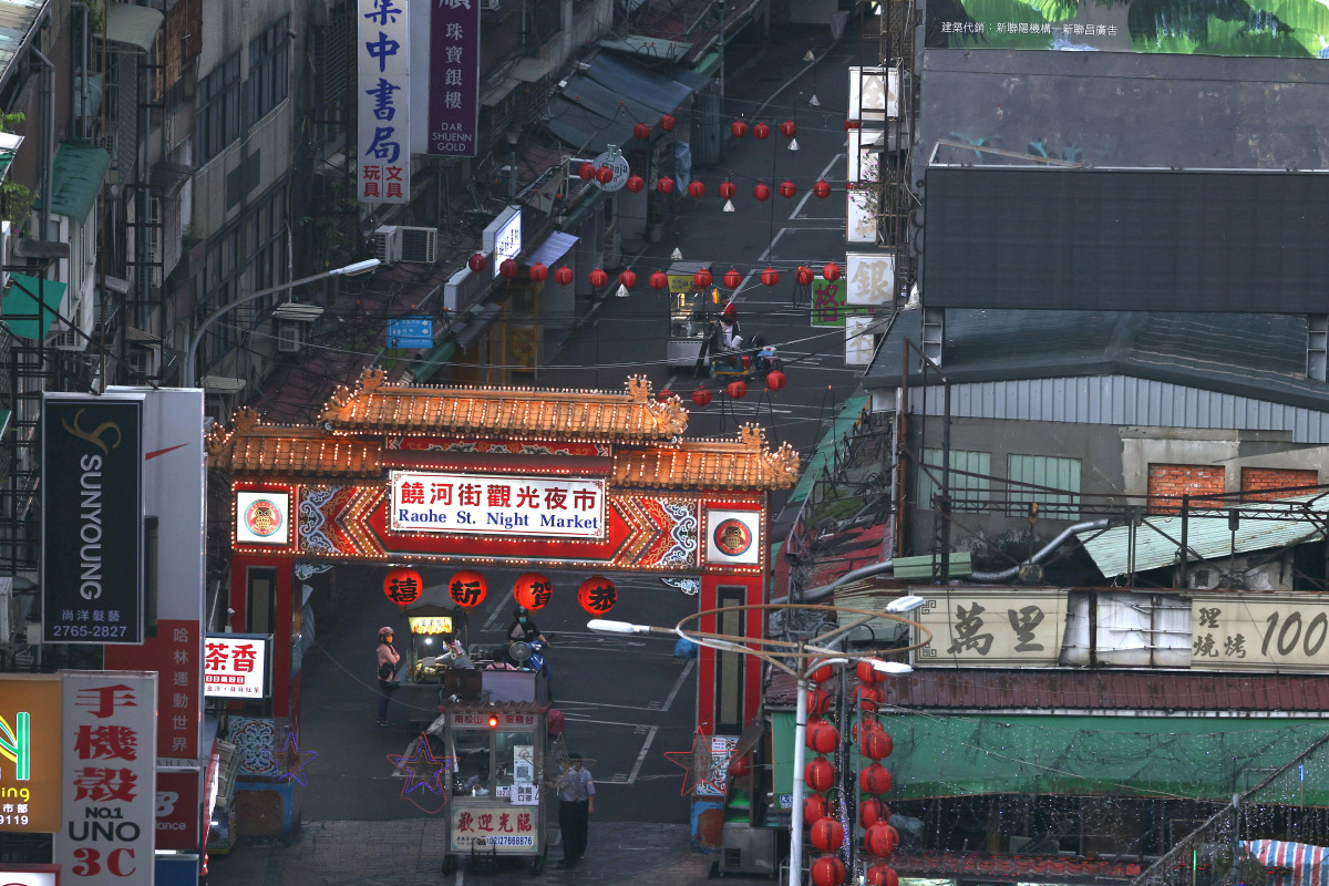 People are seen on an almost empty night market following the recent rise in the Coronavirus disease (COVID-19) infections in Taipei, Taiwan May 23, 2021. REUTERS/Ann Wang
