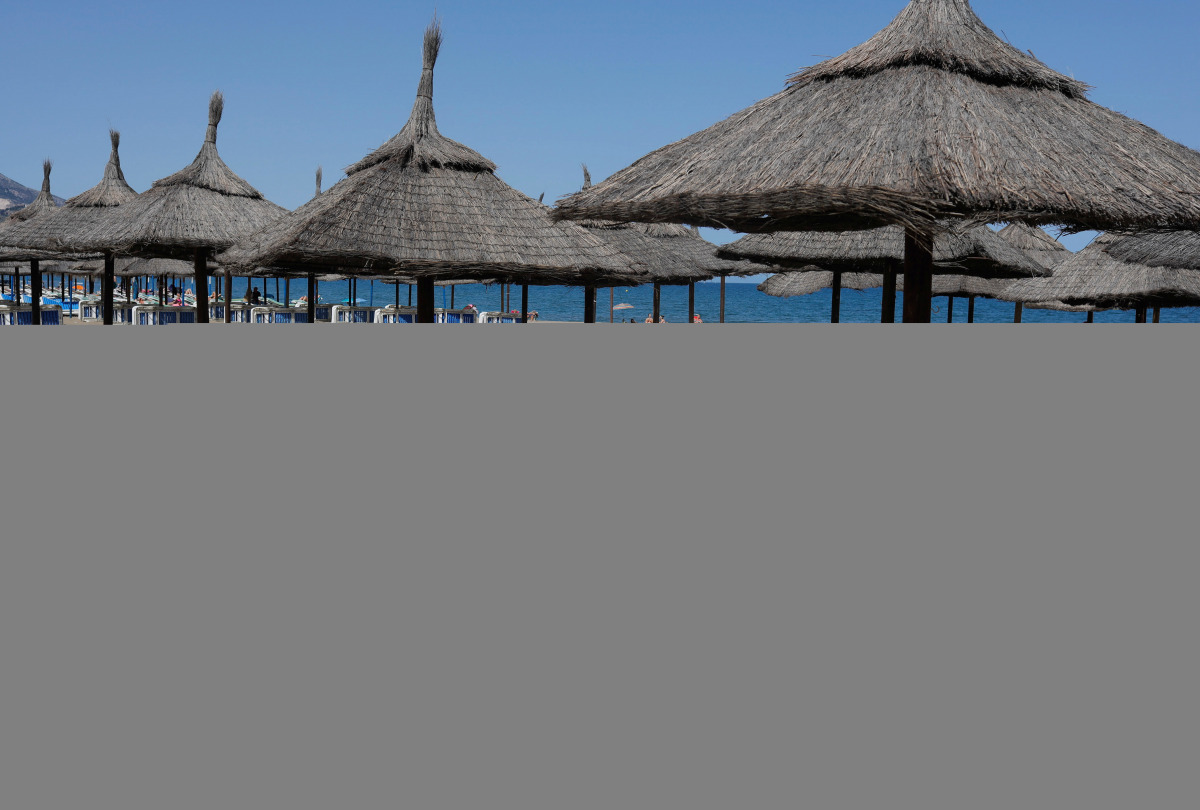 Unoccupied beach lounge chairs are seen on a half empty beach by the Mediterranean Sea, amid the coronavirus disease (COVID-19) pandemic, in Fuengirola, southern Spain, May 25, 2021. REUTERS/Jon Nazca
