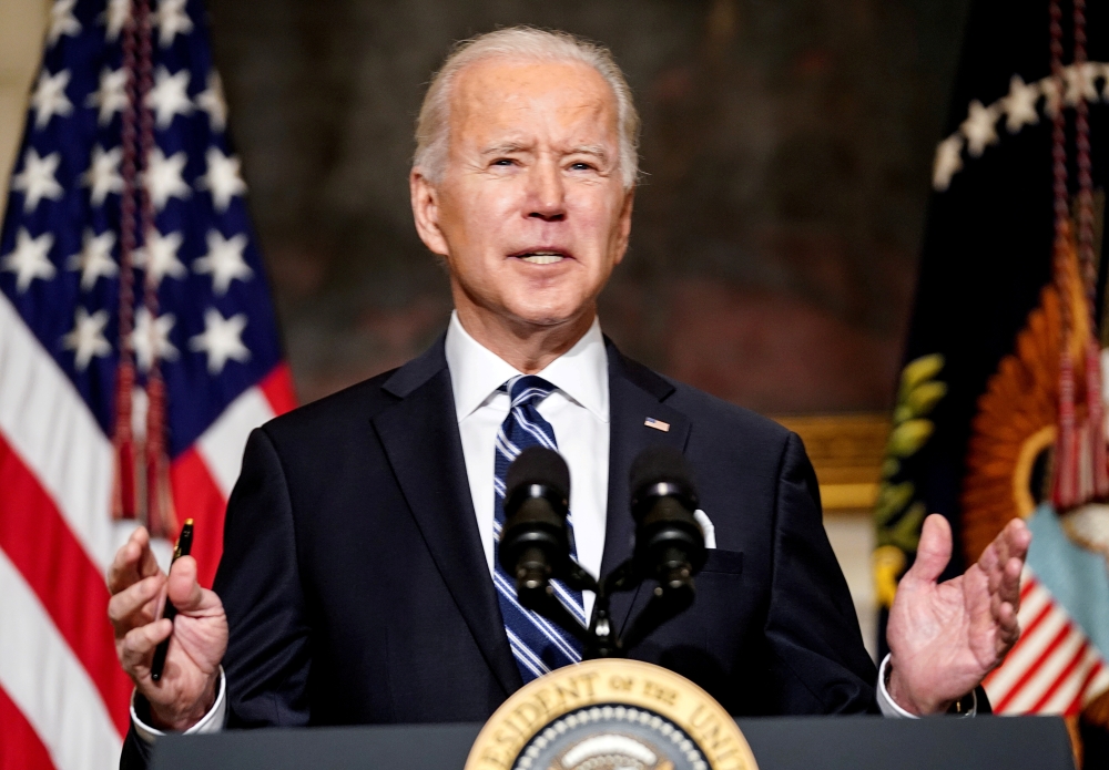 File photo: US President Joe Biden delivers remarks on tackling climate change prior to signing executive actions in the State Dining Room at the White House in Washington, U.S., January 27, 2021. REUTERS/Kevin Lamarque/File Photo