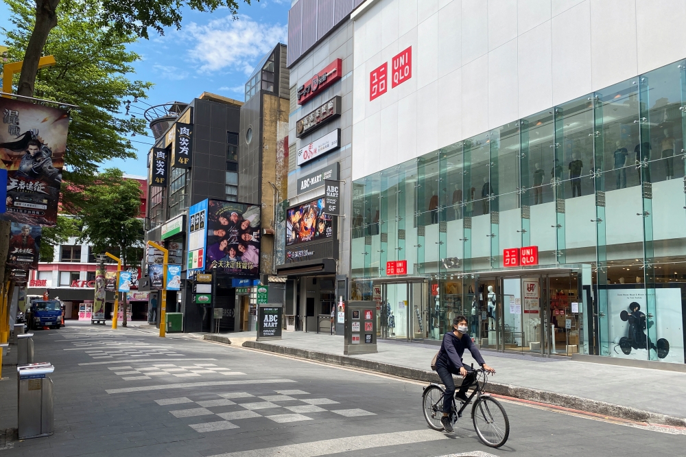 A man rides a bicycle at Ximending shopping area following the recent surge of coronavirus disease (COVID-19) infections in Taipei's Wanhua district, Taiwan, May 28, 2021. Reuters/Ben Blanchard