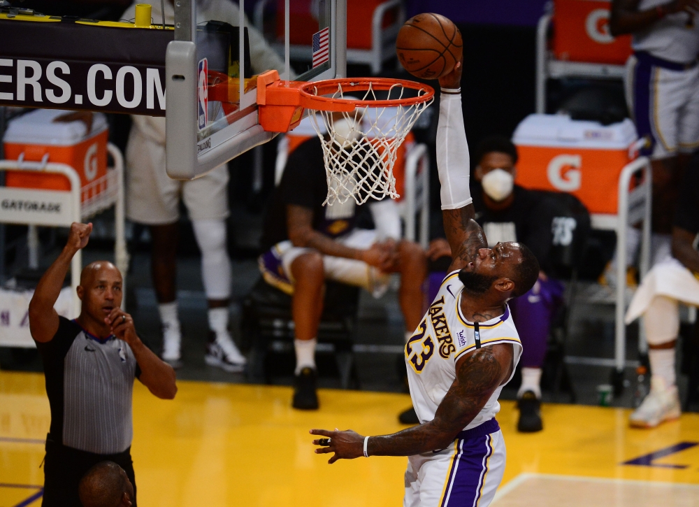 Los Angeles Lakers forward LeBron James (23) dunks for a basket against the Phoenix Suns during the second half in game four of the first round of the 2021 NBA Playoffs. 