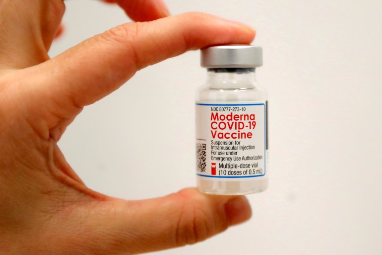 FILE PHOTO: A healthcare worker holds a vial of the Moderna COVID-19 Vaccine at a pop-up vaccination site operated by SOMOS Community Care during the coronavirus disease (COVID-19) pandemic in Manhattan in New York City, New York, U.S., January 29, 2021. 