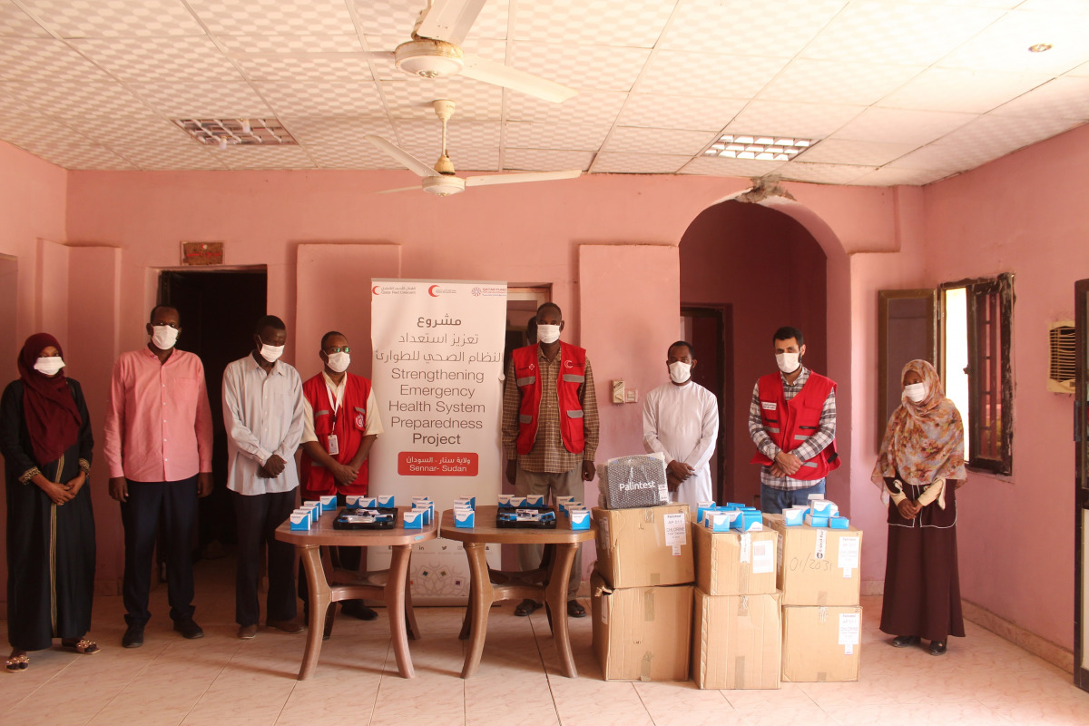 Representatives from QRCS and local authority with water testing kits to be distributed to those in need. 