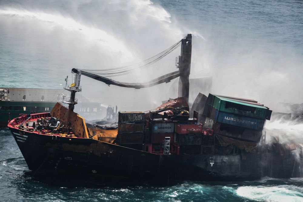 Smoke rises from a fire onboard the MV X-Press Pearl vessel in the seas off the Colombo Harbour, in Sri Lanka May 30, 2021. Sri Lanka Airforce Media/Handout via REUTERS