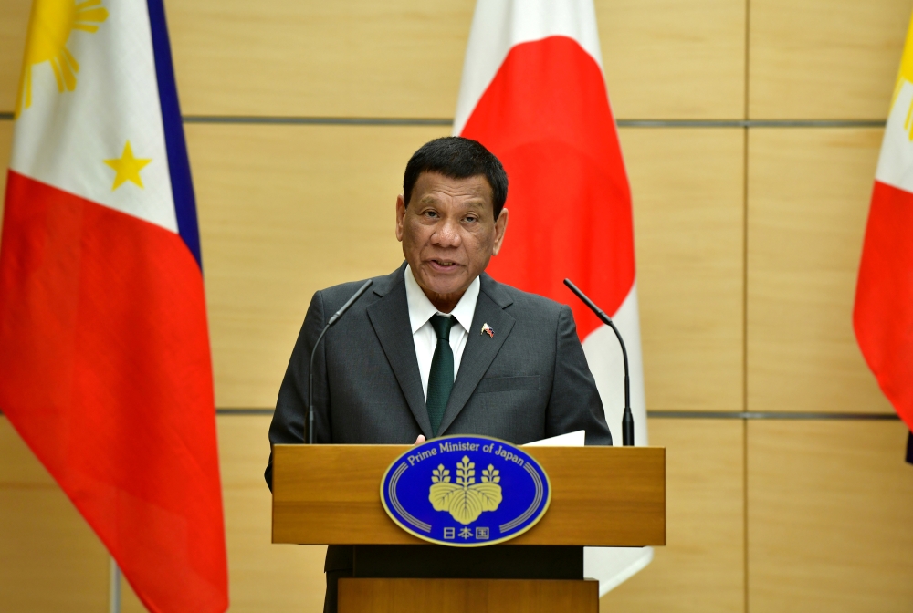 FILE PHOTO: Philippine President Rodrigo Duterte delivers a speech during their joint press statement with Japan's Prime Minister Shinzo Abe (not pictured) at Abe's official residence in Tokyo, Japan May 31, 2019. Kazuhiro Nogi /Pool via Reuters