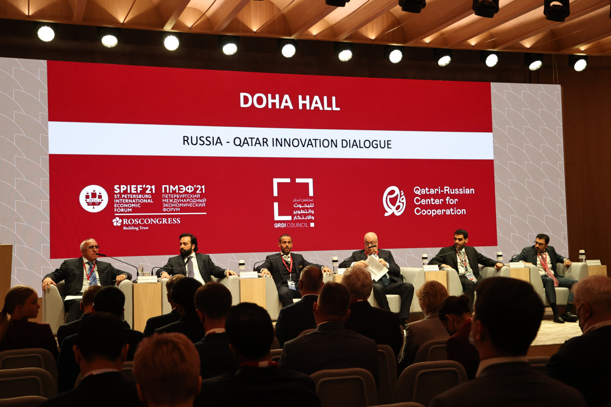 Speakers participating in a panel discussion at the Qatar Pavilion during SPIEF.