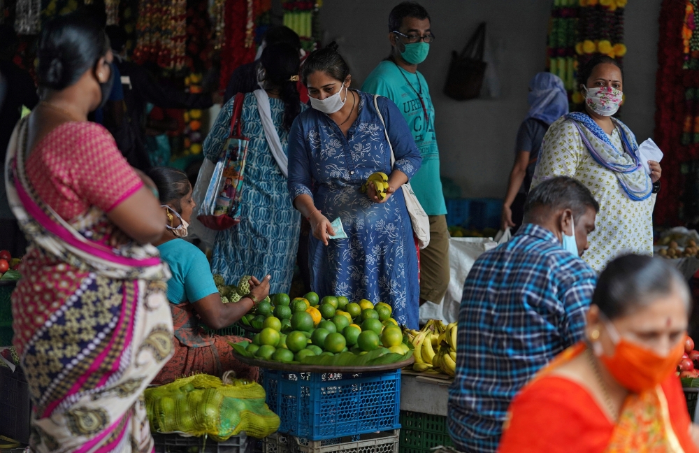 File photo: A woman wearing a protective face mask in a market, amidst the spread of the coronavirus disease (COVID-19) in Mumbai, India, August 20, 2020. Reuters/Hemanshi Kamani/File Photo