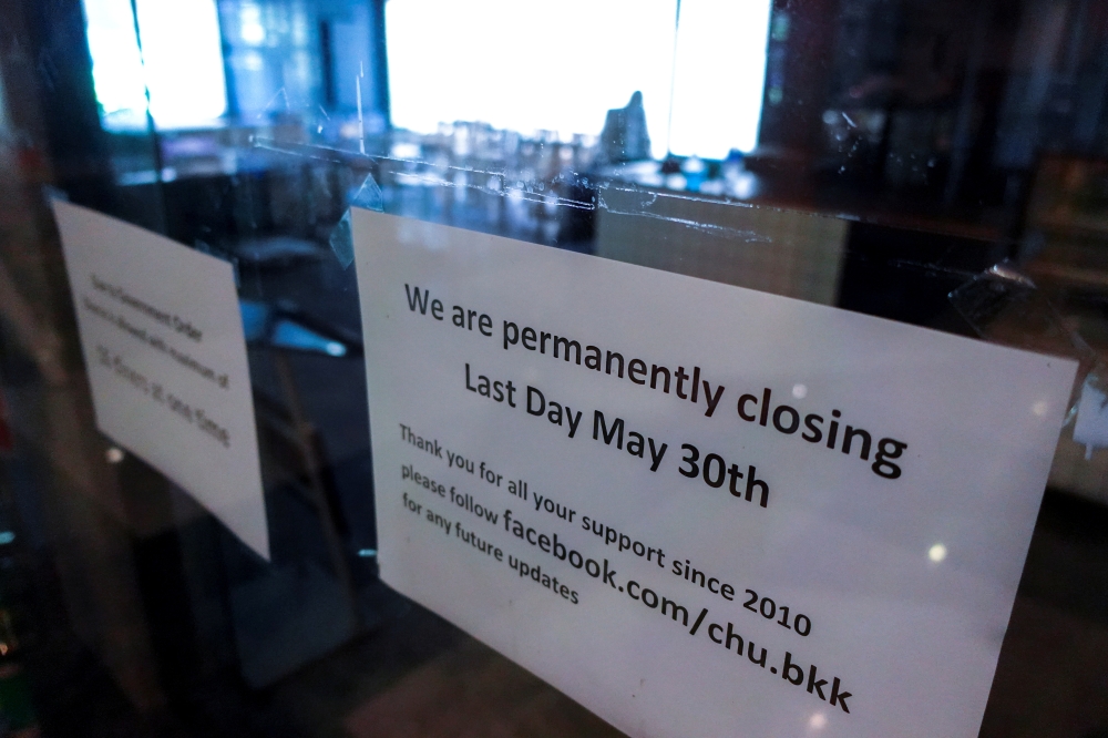 A closed sign is seen at the Chu Chocolate Bar & Cafe, days after it was permanently closed due to the coronavirus disease (COVID-19) pandemic in Bangkok, Thailand, June 1, 2021. Picture taken June 1, 2021. REUTERS/Athit Perawongmetha