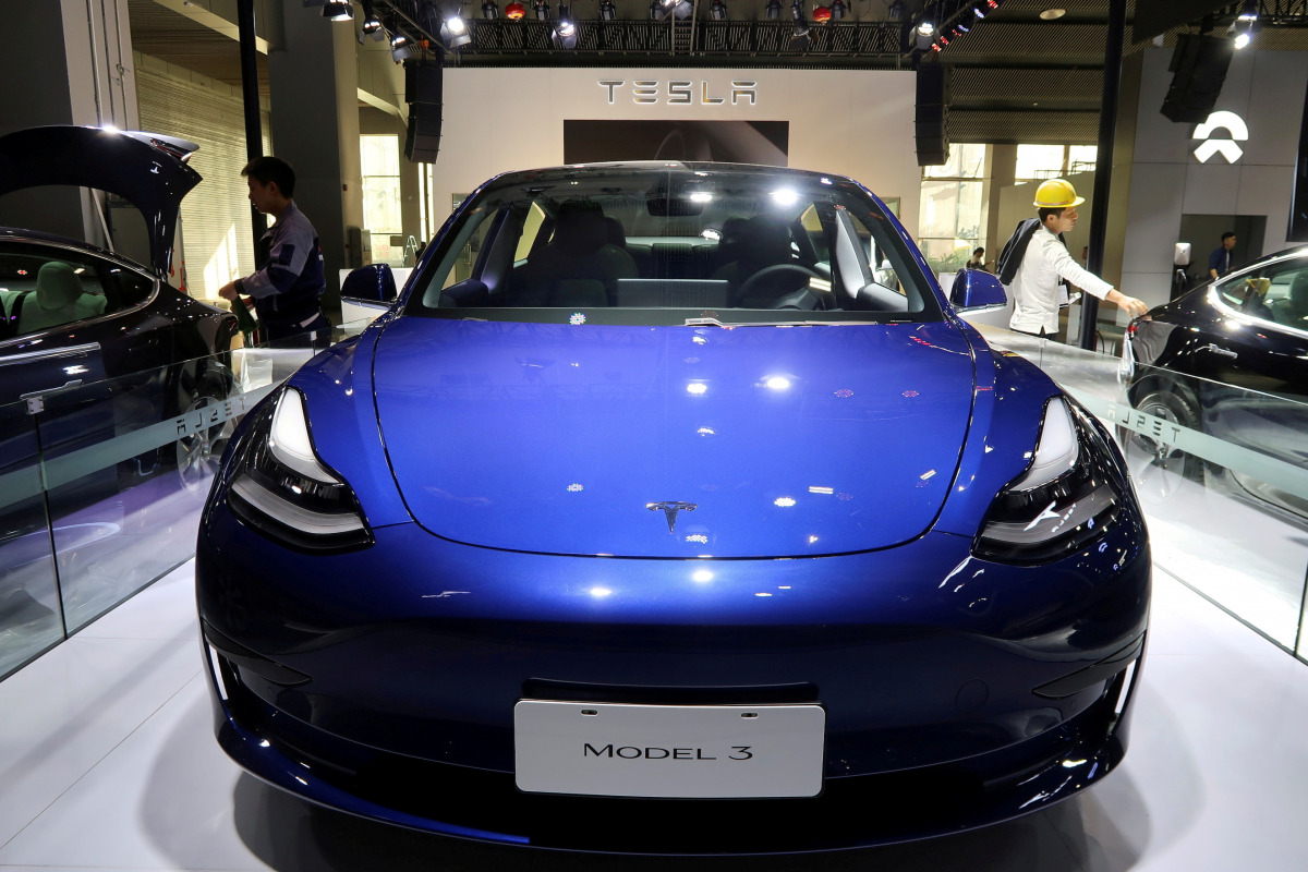 FILE PHOTO: A China-made Tesla Model 3 electric vehicle is seen ahead of the Guangzhou auto show in Guangzhou, Guangdong province, China, November 21, 2019. REUTERS/Yilei Sun/File Photo
