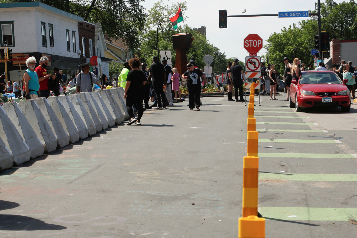 New bike lane safety posts line the street after city employees began to reopen George Floyd Square, the area where George Floyd was killed in Minneapolis police custody the year before, in Minneapolis, Minnesota, U.S., June 3, 2021. REUTERS/Nicole Neri
