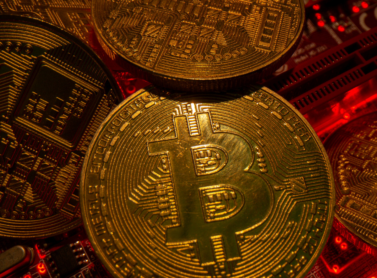 FILE PHOTO: Representations of the virtual currency bitcoin stand on a motherboard in this picture illustration taken May 20, 2021. REUTERS/Dado Ruvic/Illustration/File Photo
