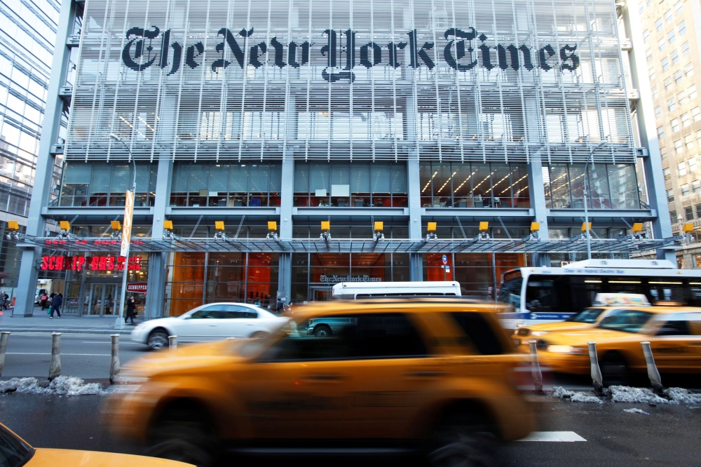 Vehicles drive past the New York Times headquarters in New York March 1, 2010. REUTERS/Lucas Jackson/File Photo