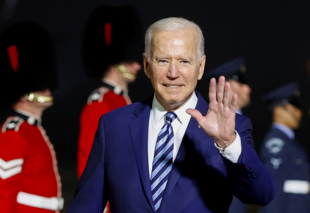 U.S. President Joe Biden waves upon arrival at Cornwall Airport Newquay, near Newquay, Cornwall, Britain June 9, 2021. REUTERS/Phil Noble/Pool