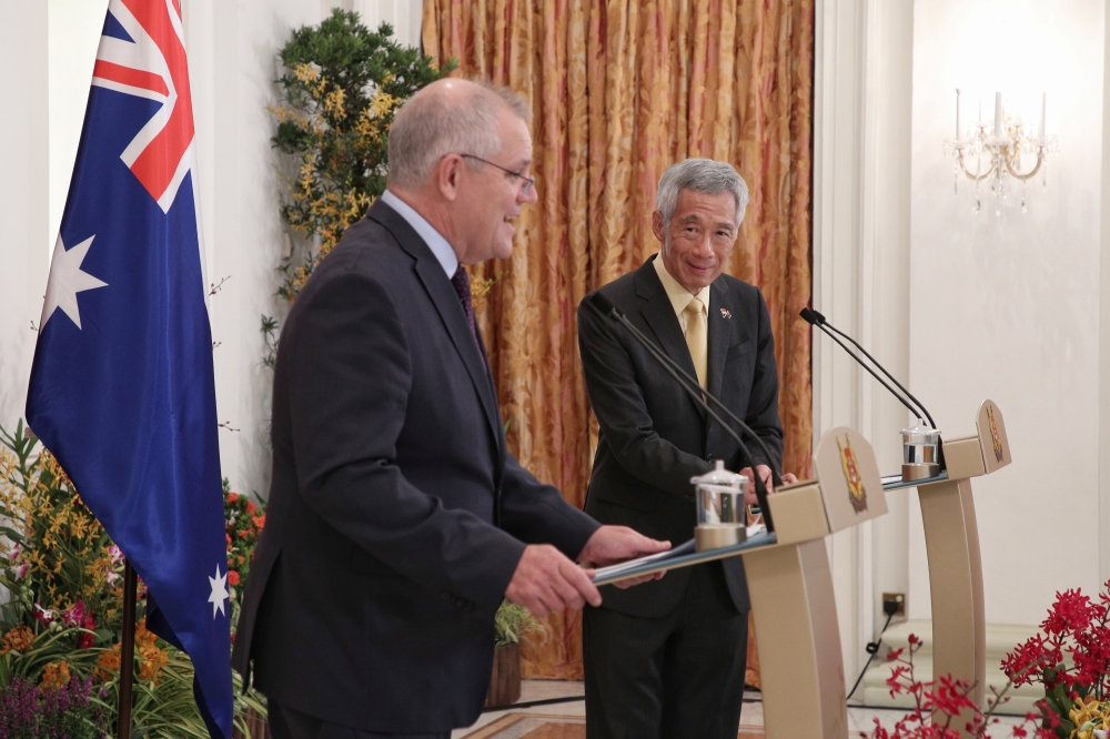 Australia's Prime Minister Scott Morrison and Singapore's Prime Minister Lee Hsien Loong give a joint news conference at the Istana in Singapore June 10, 2021. Ministry of Communications and Information/Handout via REUTERS
