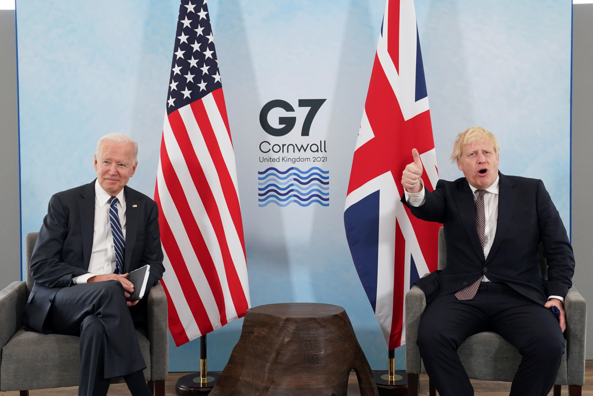 Britain's Prime Minister Boris Johnson gives a thumb up as U.S. President Joe Biden looks on during their meeting, ahead of the G7 summit, at Carbis Bay, Cornwall, Britain June 10, 2021REUTERS/Kevin Lamarque
