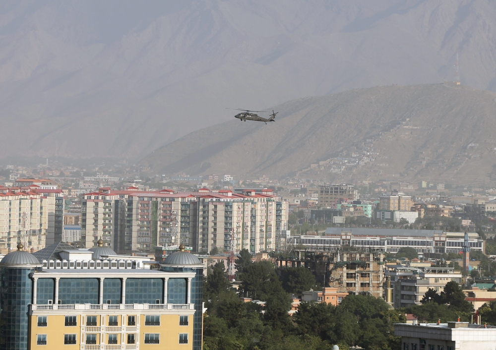 File photo: A NATO helicopter flies over the city of Kabul, Afghanistan June 29. 2020. Reuters/Omar Sobhani/File Photo
 