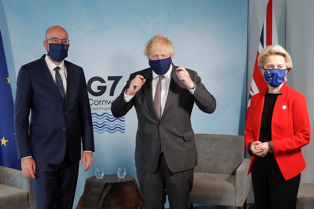 Britain's Prime Minister Boris Johnson meets with European Commission President Ursula von der Leyen and European Council President Charles Michel during the G7 summit in Carbis Bay, Cornwall, Britain, June 12, 2021. REUTERS/Peter Nicholls/Pool