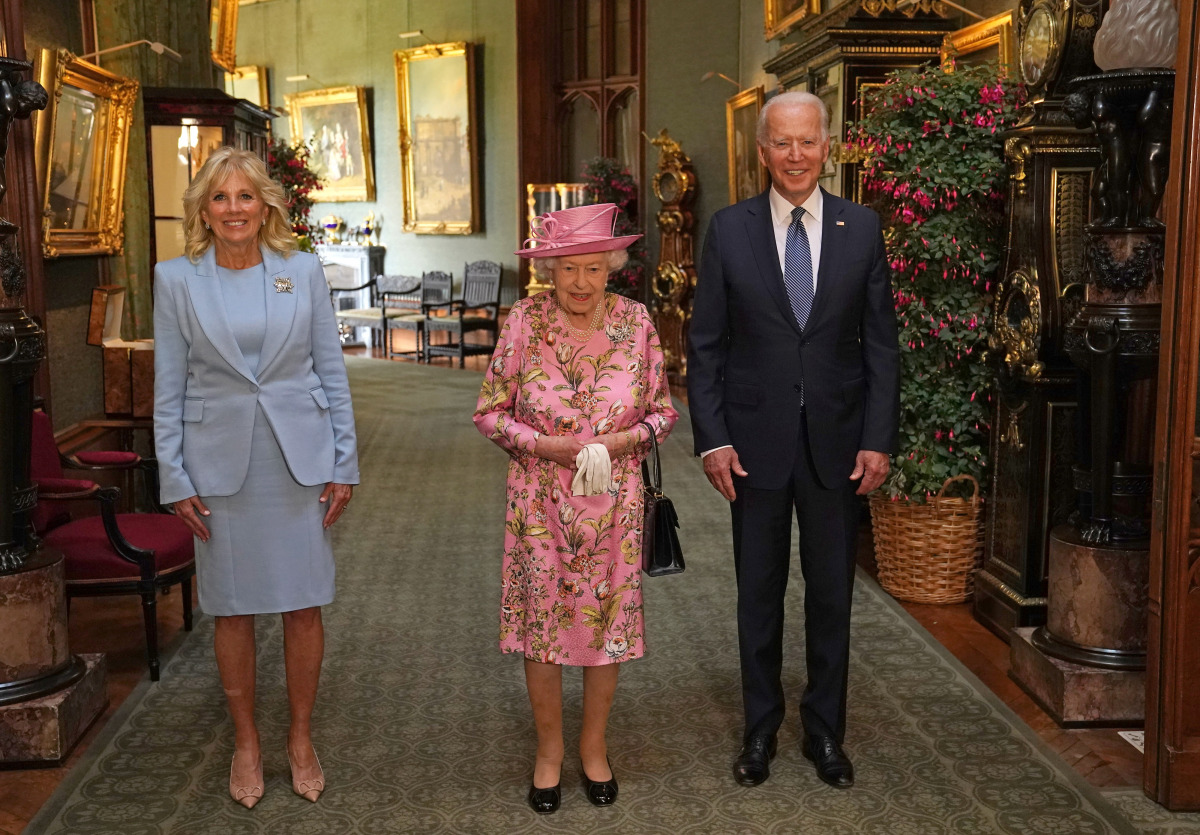 Britain's Queen Elizabeth stands with U.S. President Joe Biden and first lady Jill Biden in the Grand Corridor during their visit at Windsor Castle, in Windsor, Britain, June 13, 2021. Steve Parsons/Pool via REUTERS
