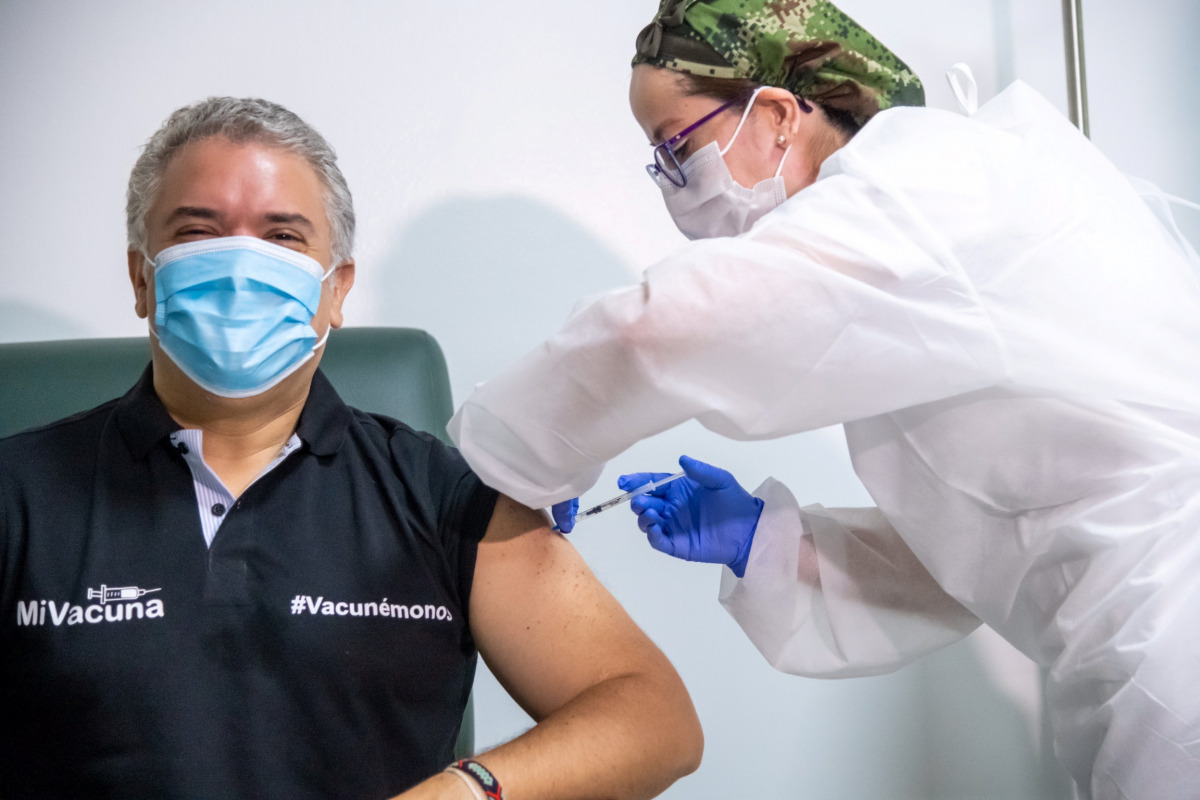 Colombia's President Ivan Duque gets his first shot of the Pfizer-BioNTech COVID-19 vaccine, in Bogota, Colombia June 13, 2021. Colombia Presidency/Handout via REUTERS ATTENTION EDITORS - THIS IMAGE HAS BEEN SUPPLIED BY A THIRD PARTY. NO RESALES. NO ARCHI
