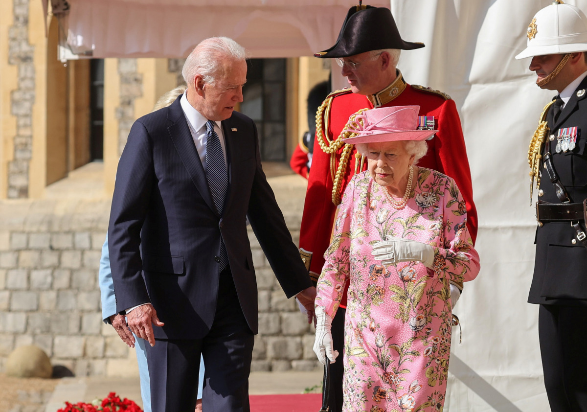Britain's Queen Elizabeth walks with U.S. President Joe Biden and first lady Jill Biden as they meet at Windsor Castle, in Windsor, Britain, June 13, 2021. Chris Jackson/Pool via REUTERS

