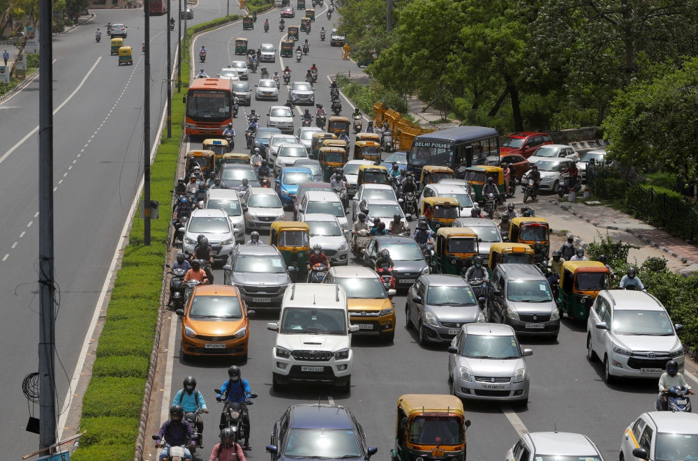 Vehicles are pictured on a road, after authorities eased lockdown restrictions that were imposed to slow the spread of the coronavirus disease (Covid-19), in New Delhi, India, June 8, 2021. Reuters/Adnan Abidi