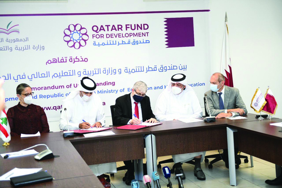 Representatives from Qatar Fund for Development and the Ministry of Education and Higher Education of Lebanon signing an MoU.
