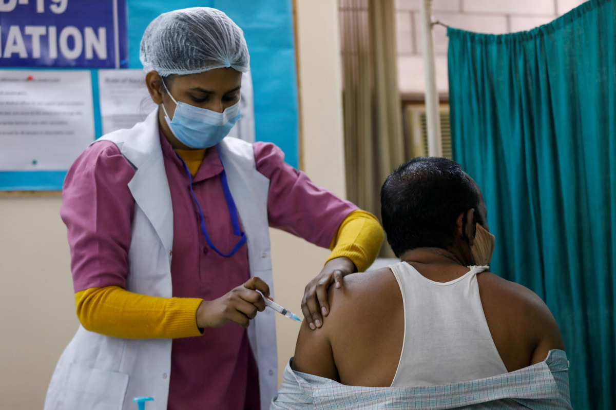 A man receives a Bharat Biotech's COVID-19 vaccine called COVAXIN, at a vaccination centre, in New Delhi, India, February 13, 2021. REUTERS/Adnan Abidi


