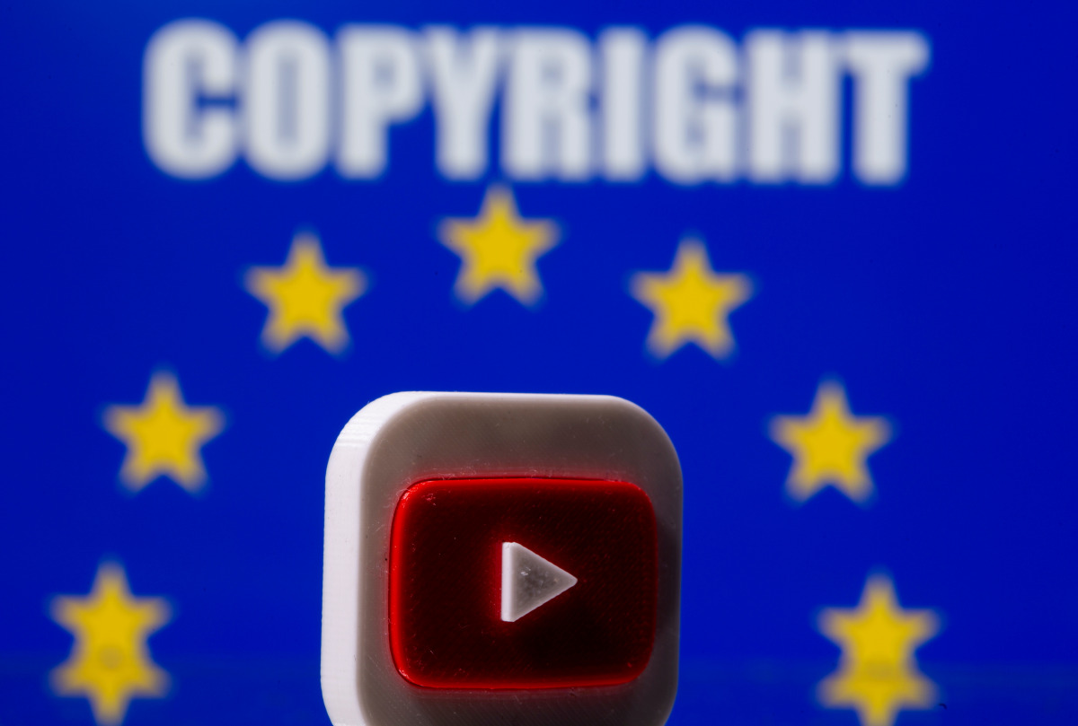 A 3D printed Youtube logo is seen in front of a displayed EU flag and copyright words in this illustration picture taken on June 21, 2021. REUTERS/Dado Ruvic/Illustration
