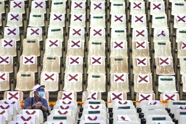 A man waits at the observation area after receiving the vaccine against the coronavirus disease (COVID-19), during a vaccination session for elderly people over 85 years old, at an auditorium in New Taipei City, Taiwan June 16, 2021. REUTERS/Ann Wang