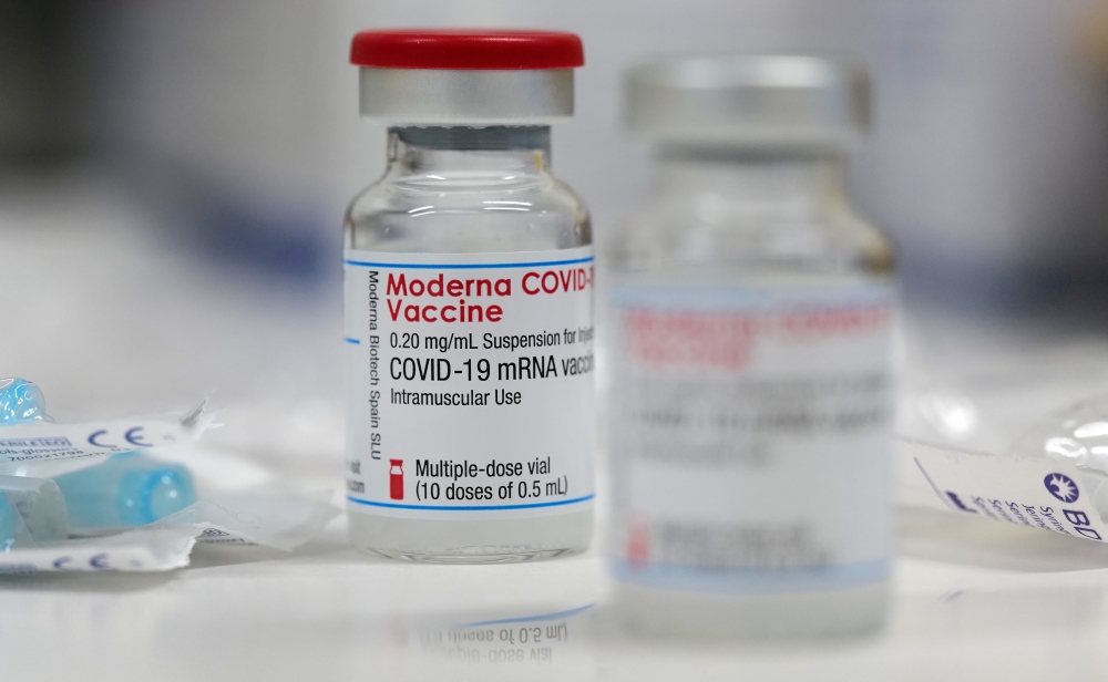 A vial of the Moderna COVID-19 vaccine is seen at a local clinic as the spread of the coronavirus disease continues in Aschaffenburg, Germany, January 15, 2021. REUTERS/Kai Pfaffenbach/File Photo