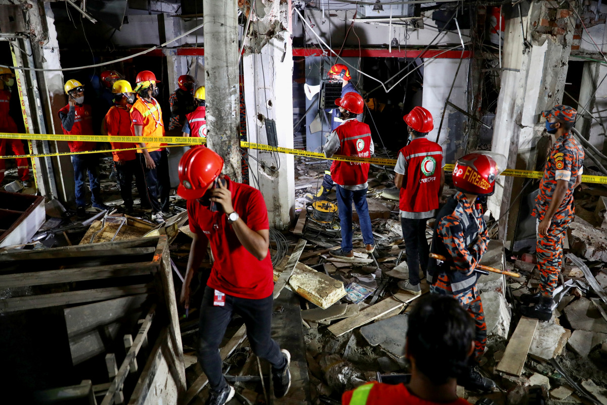 Rescue workers work at the site after a blast in a shop that killed several people in Dhaka, Bangladesh, June 27, 2021. REUTERS/Mhammad Ponir Hossain
