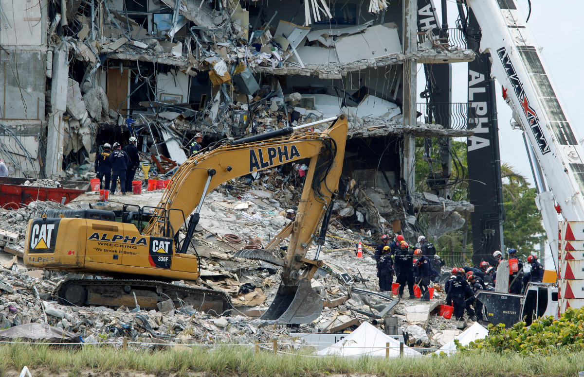 Emergency workers conduct search and rescue missions at the site of a partially collapsed residential building in Surfside, near Miami Beach, Florida, U.S. June 28, 2021. REUTERS/Joe Skipper
