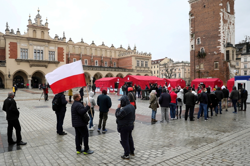 People queue up outside a mass vaccination centre to receive a Johnson & Johnson jab against coronavirus disease (COVID-19) without prior registration during the campaign 