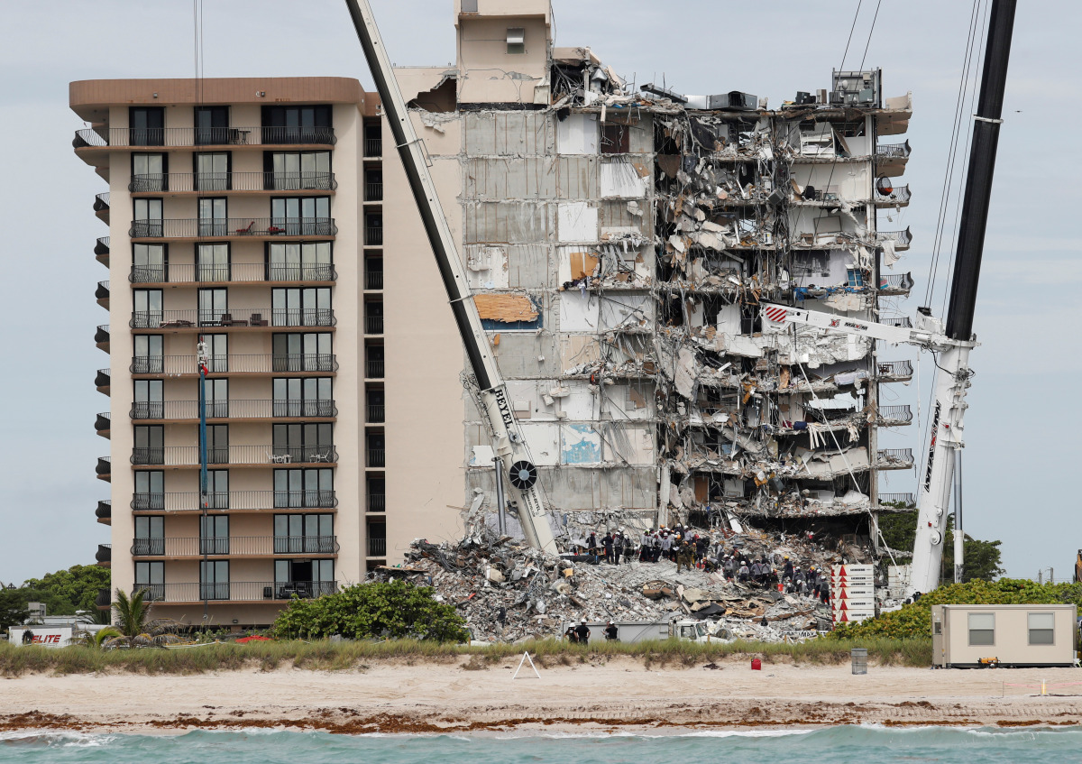 Emergency workers conduct search and rescue efforts at the site of a partially collapsed residential building in Surfside, near Miami Beach, Florida, U.S. June 29, 2021. REUTERS/Joe Skipper
