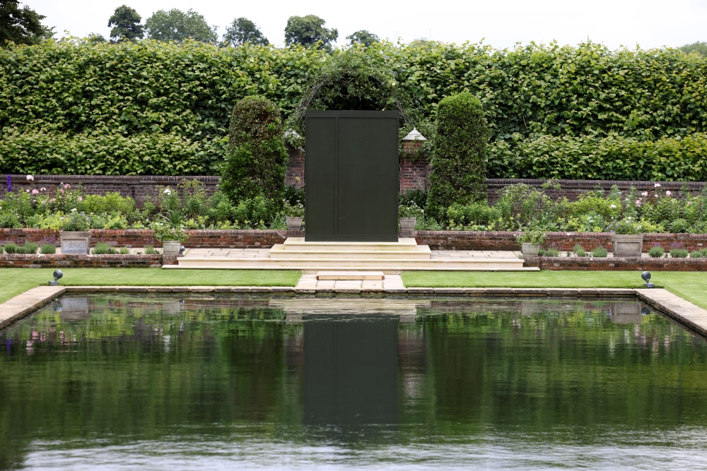 A box covers the statue of Britain's Princess Diana installed in the Sunken Garden of Kensington Palace in London, Britain, June 30, 2021. REUTERS/Henry Nicholls