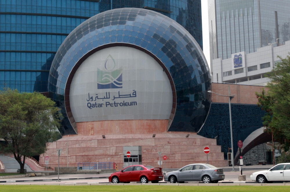 Cars are parked outside the headquartes of Qatar Petroleum in Doha, Qatar, July 8, 2017. Picture taken July 8, 2017. REUTERS/Stringer/File Photo