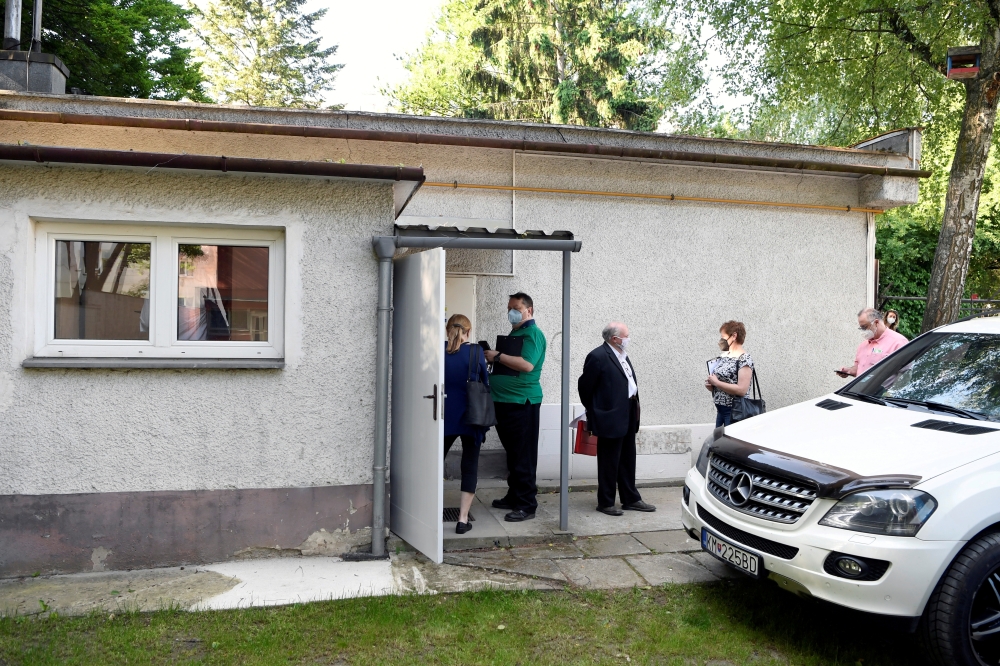 People wait to receive the Sputnik V vaccine against the coronavirus disease (COVID-19) at a vaccination centre in Zilina, Slovakia June 7, 2021. REUTERS/Radovan Stoklasa/File Photo