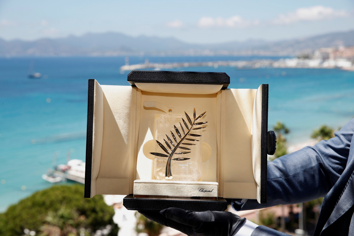The 74th Cannes Film Festival - The Palme d'Or Award - Cannes, France, July 5, 2021. A Chopard representative displays the Palme d'Or, the highest prize awarded to competing films, during an interview before the start of film festival. REUTERS/Gonzalo Fue