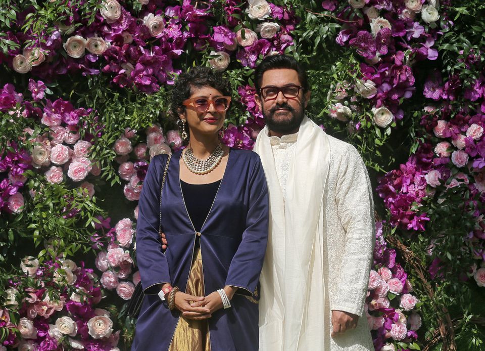 FILE PHOTO: Bollywood actor Aamir Khan and his wife Kiran Rao pose during a photo opportunity at the wedding ceremony of Akash Ambani, son of the Chairman of Reliance Industries Mukesh Ambani, at Bandra-Kurla Complex in Mumbai, India, March 9, 2019. REUTE