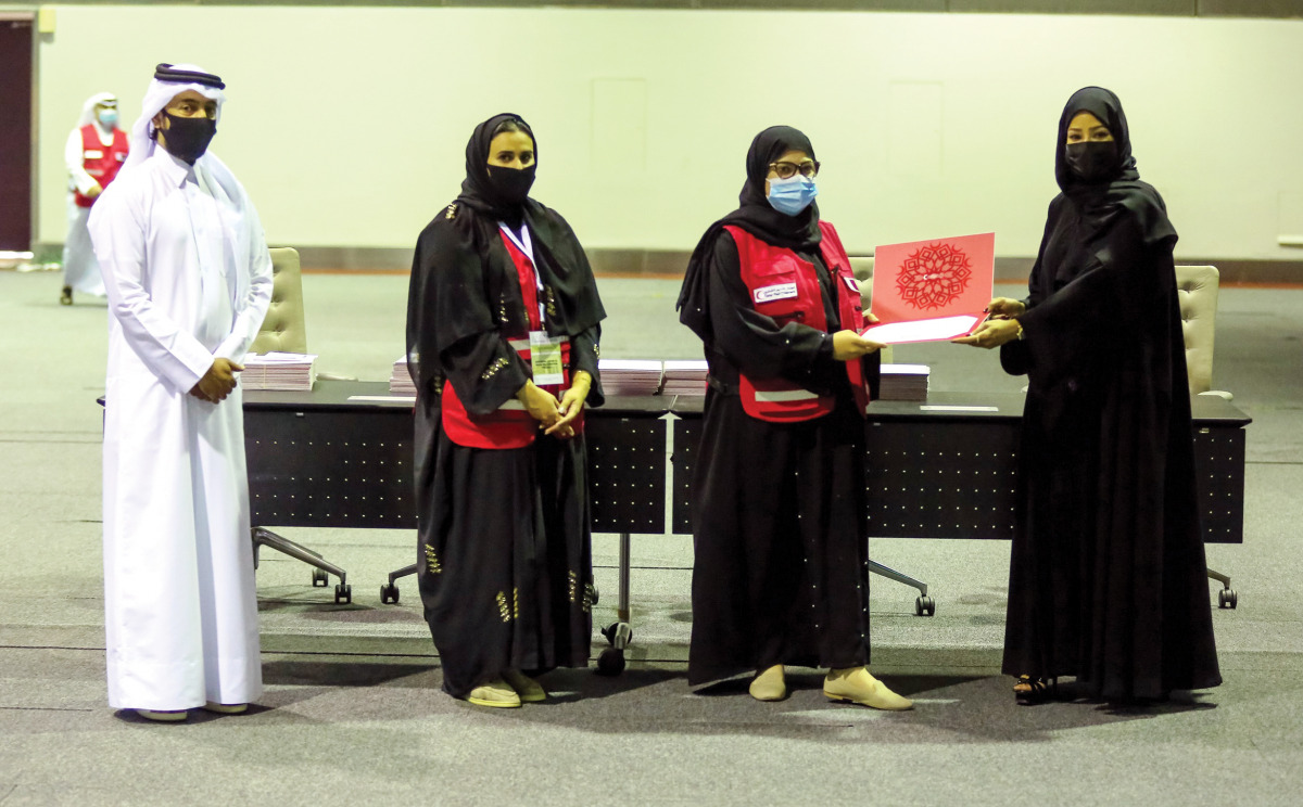 QRCS volunteers and other officials during a ceremony at QNCC.