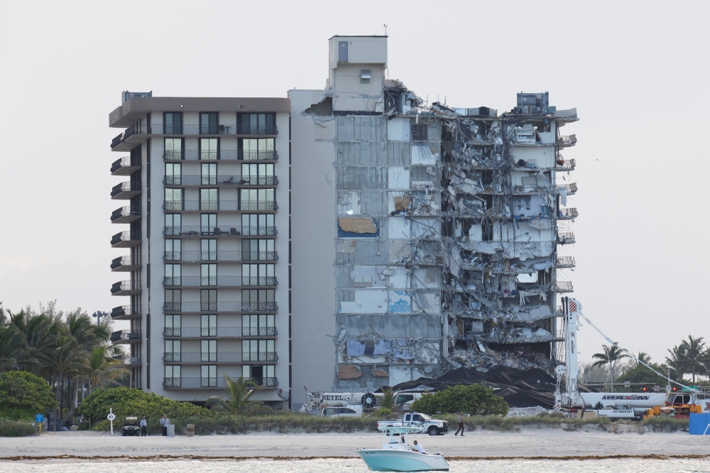 FILE PHOTO: View of the partially collapsed residential building as rescue operations are stopped, in Surfside, Florida, U.S., July 4, 2021. REUTERS/Marco Bello